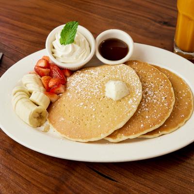 Served pancakes in white plate.