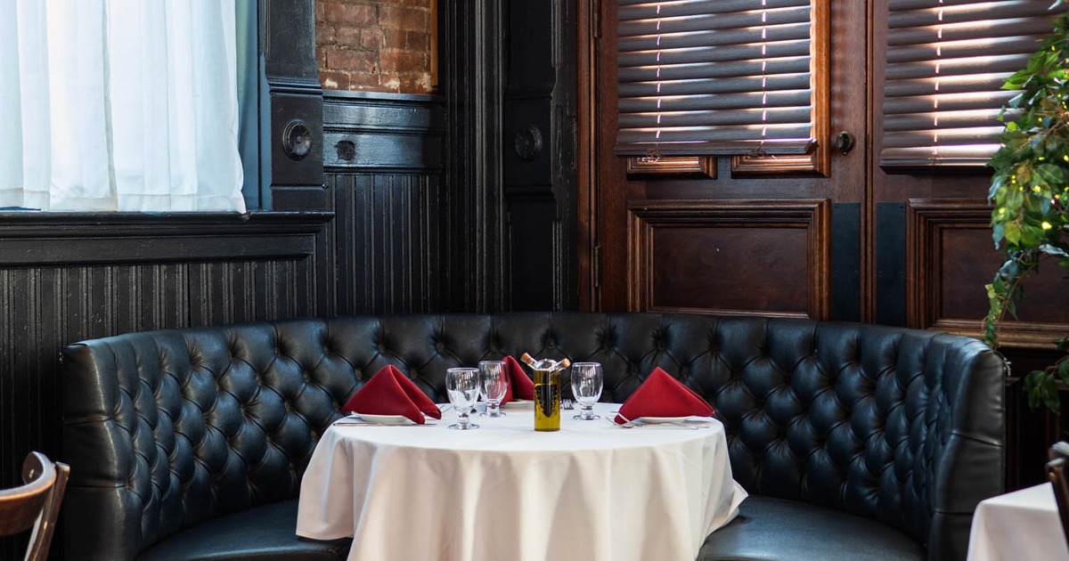 Interior, leather booth, table served for guests
