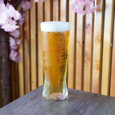 Chilled beer in a tall glass.