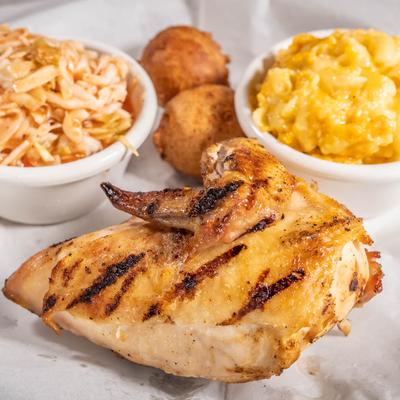 Smoked chicken with a side of slaw and mac and cheese