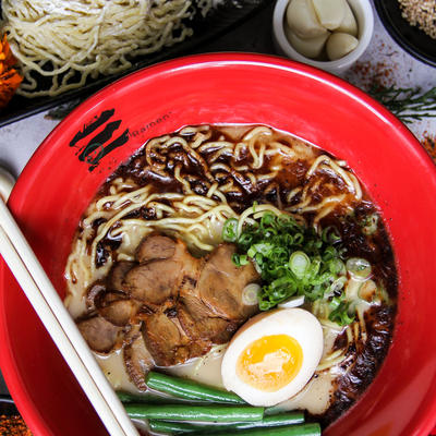 Steak, noodles, snap beans egg and soy sauce ramen top view