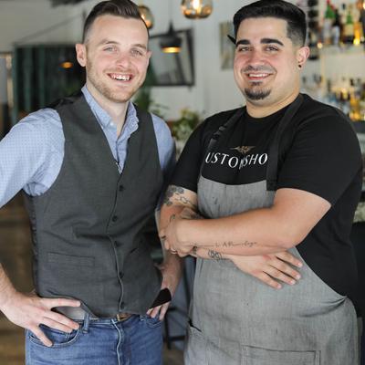 The staff in front of the bar pose