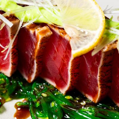 Seared tuna with wasabi mayo & eel sauce served over seaweed salad.