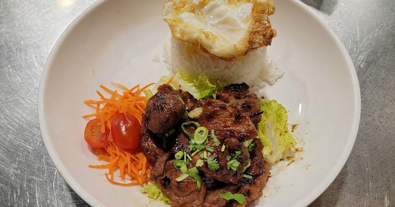 Grilled beef, with veggies, rice, and a fried egg