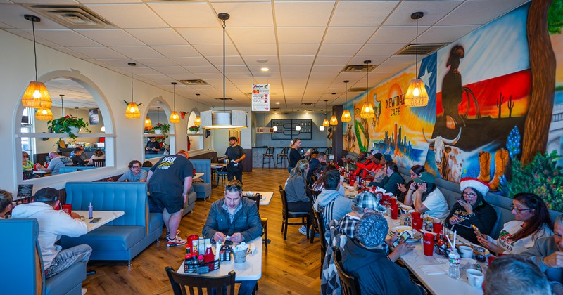 Spacious interior dining area full of guests enjoying their food and drinks