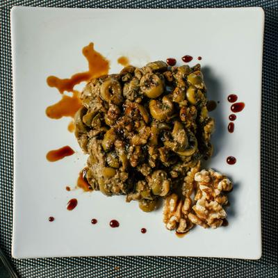 Herb, olive, walnut, garlic, and pomegranate spread.