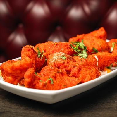 Basa fish marinated with herbs, spices, and fried to a golden crisp.