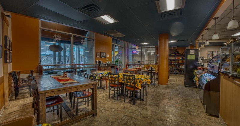 Interior, dining area, tables with chairs, ready for guests, restaurant entrance, large shop window