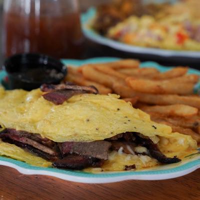 Smoked brisket omelet with fries.