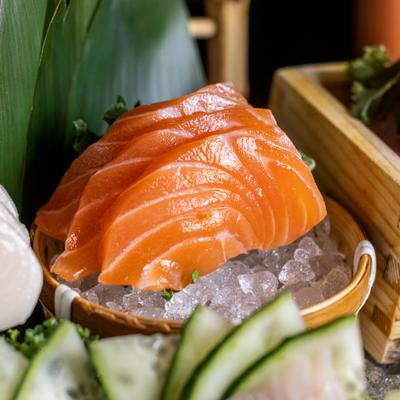 Sashimi Platter featuring slices of raw salmon served on a bed of ice.