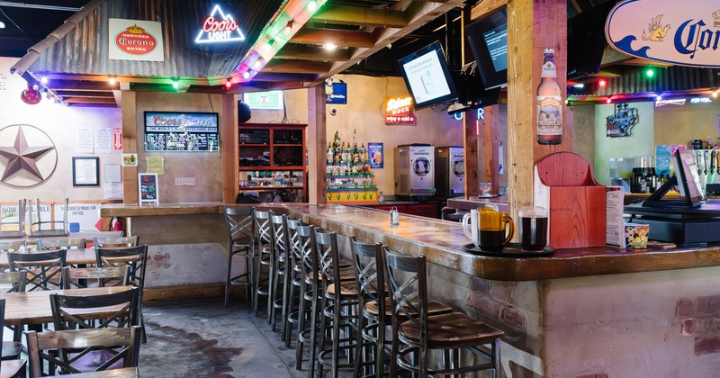 Interior, bar area with neon signs