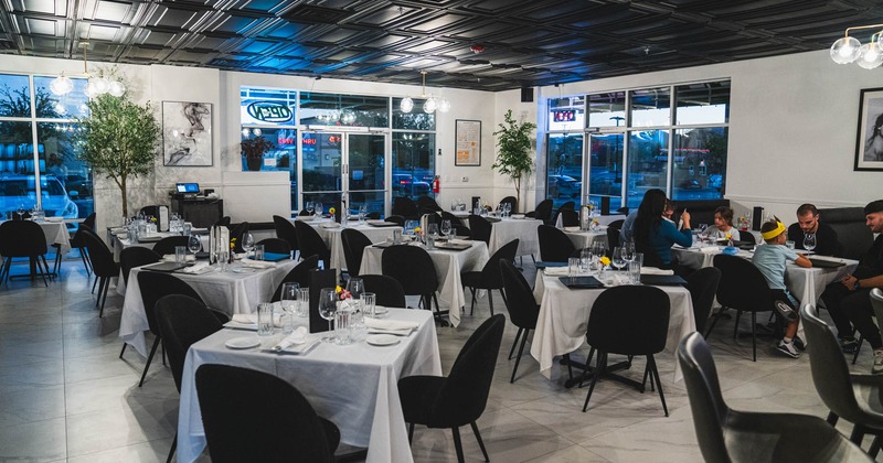 Interior, wide view of dining area, tables and chairs