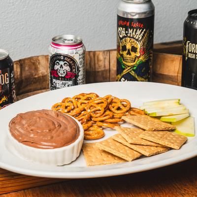 Chocolate Hazelnut Dip with Pretzels, cheese, apple, Crackers, canned drinks.