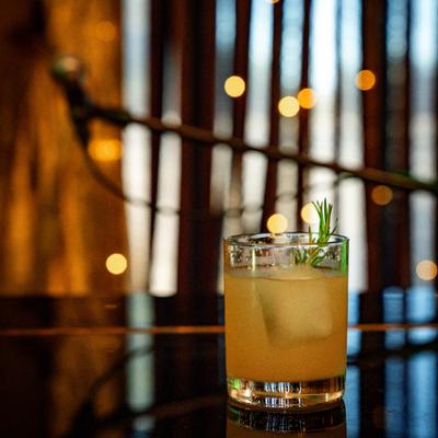 Bourbon Rosemary Smash cocktail on a counter.