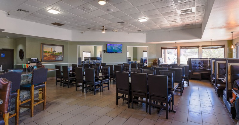 Interior, lined up tables ready for guests, booths