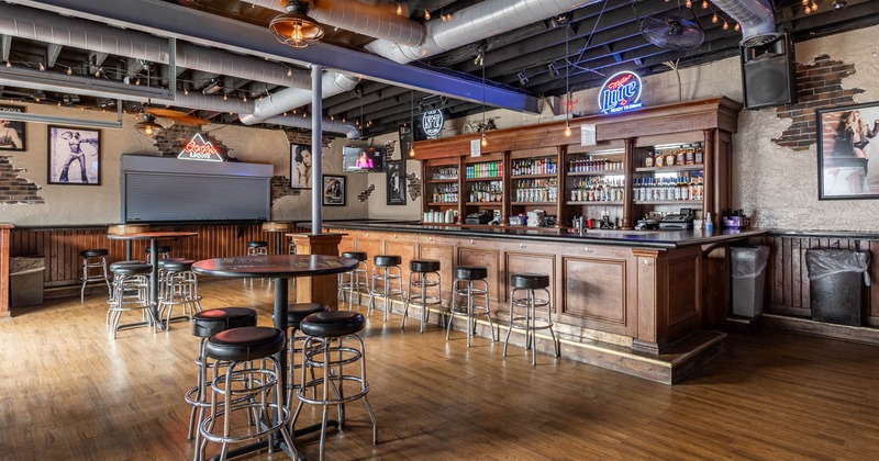 Interior, bar area, tall tables and bar stools