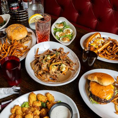 Assortment of dishes and drinks spread on a table.