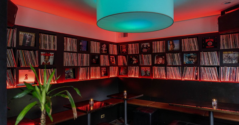 Interior, seating area and a wall shelf with books