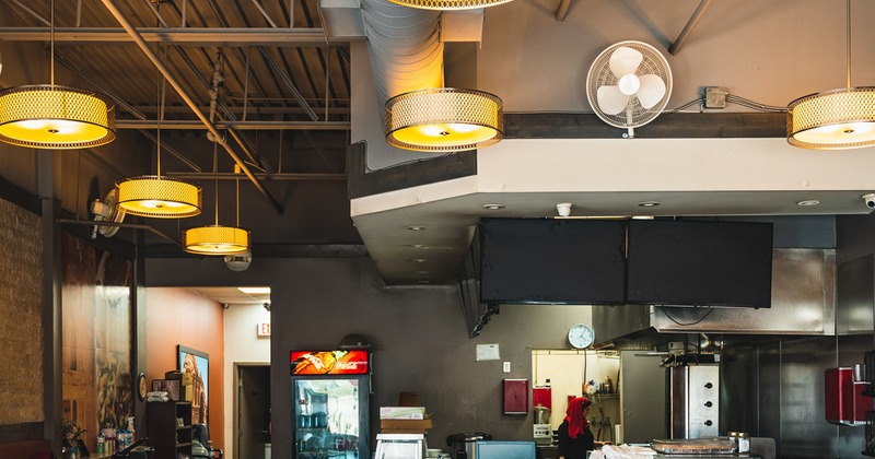 Diner tables and chairs, bar behind