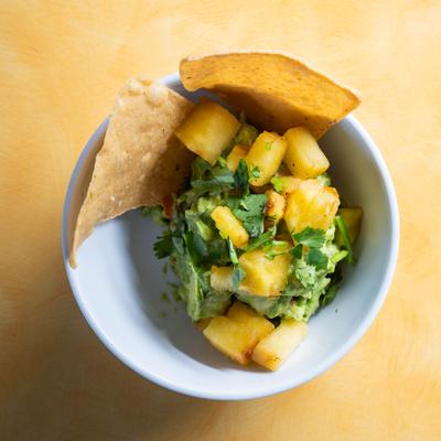 Pineapple guacamole with chips.
