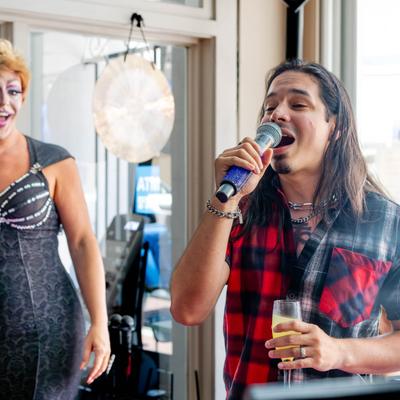 Interior, a customer singing on a stage.