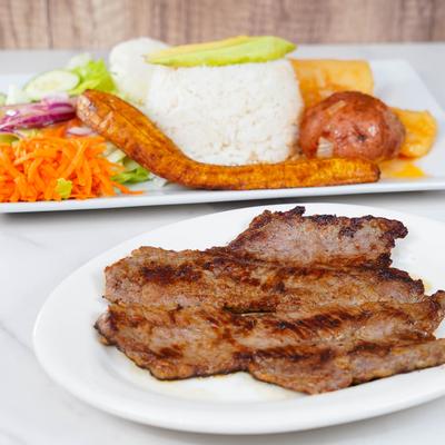 Steak plate and a plate with  various sides.