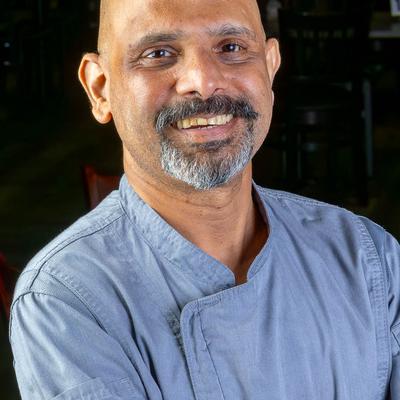 Smiling chef, head shot.