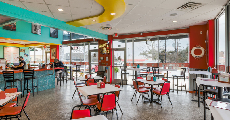 Interior, dining tables ready for guests