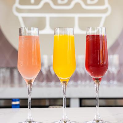 Three glasses of mimosas.