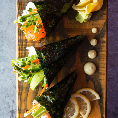 Various types of sushi, lemon on the side