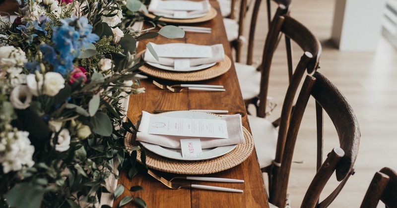 Elegant wedding table with a floral centerpiece and place settings