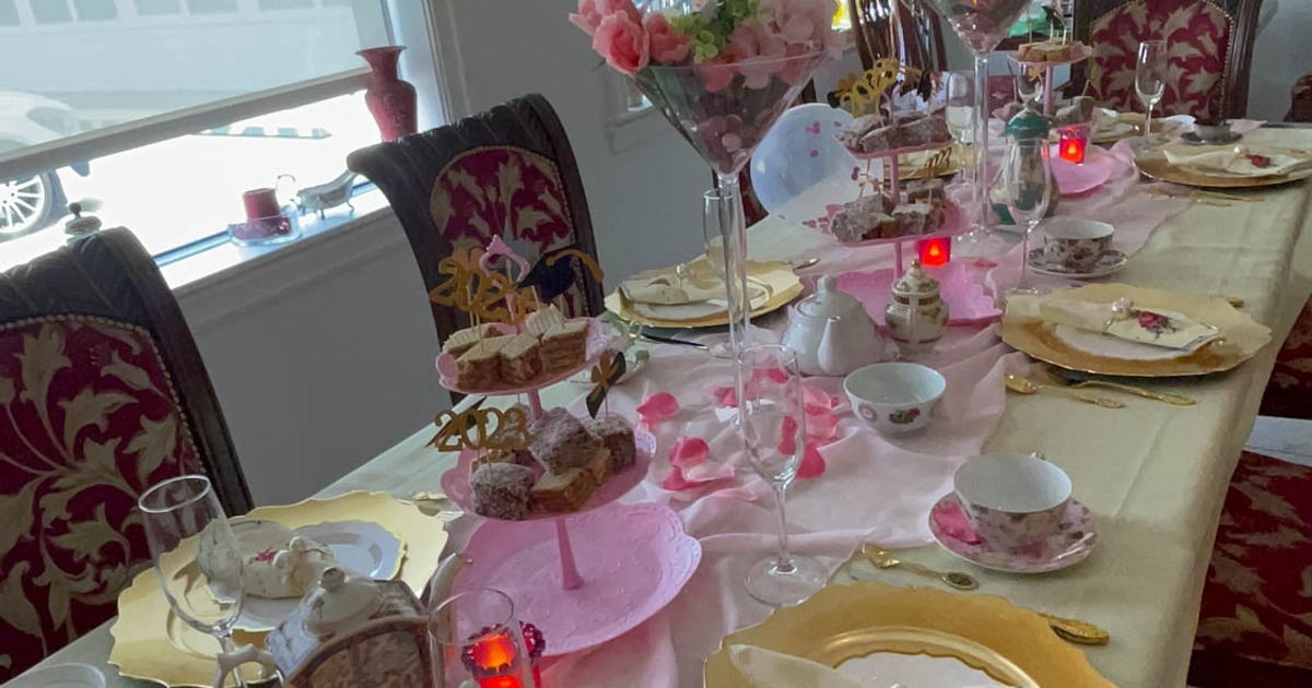 Dining tables with tea sets and pastries