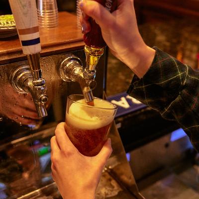 Bartender pouring beer from the tap.