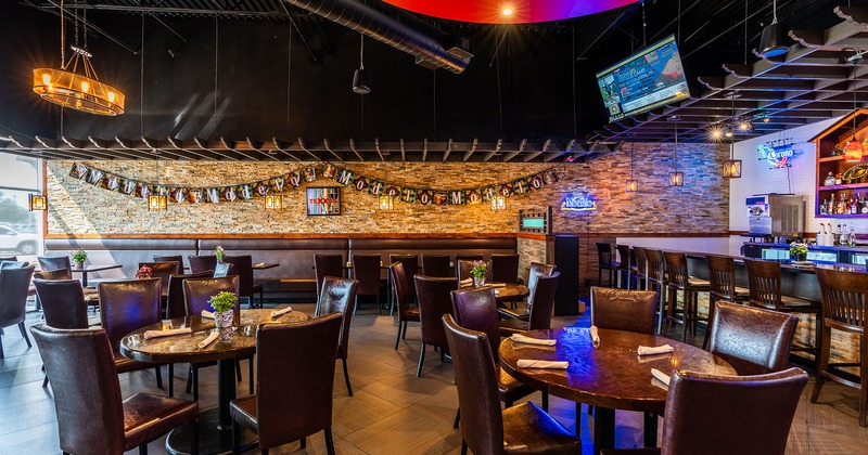 Spacious and cozy interior dining area with tables ready for guests