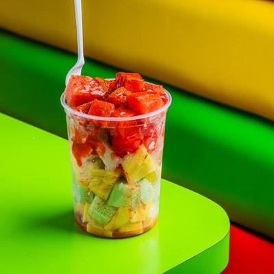 A cup of fresh fruit.