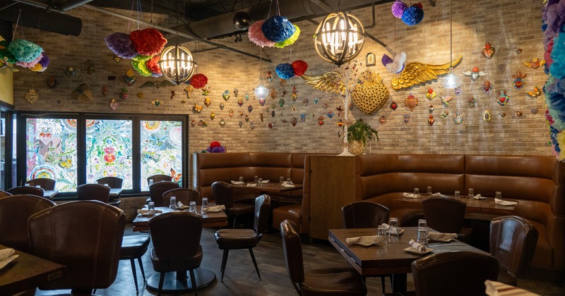 Interior, leather chairs and booths. colorful chandeliers