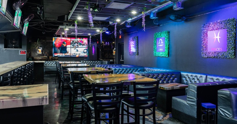 Interior, tables and chairs lined up, seating booths on the right