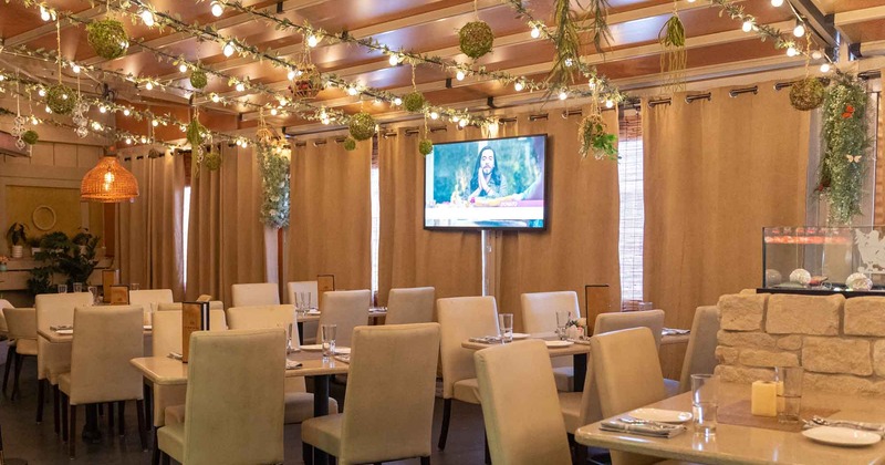 A diner room, tv on the wall