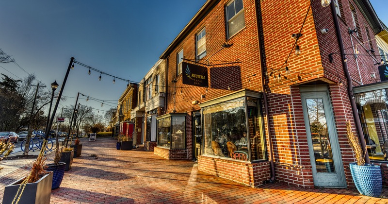 Exterior, store-front patio with brick walls