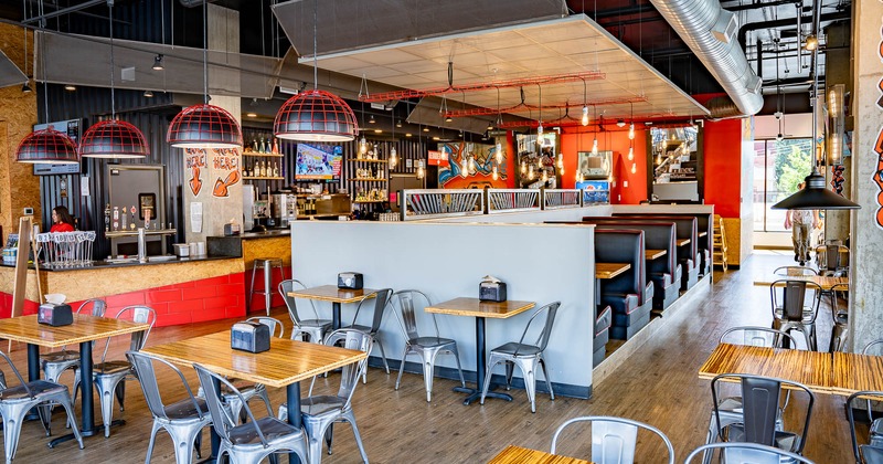 Interior, tables and chairs in dining area