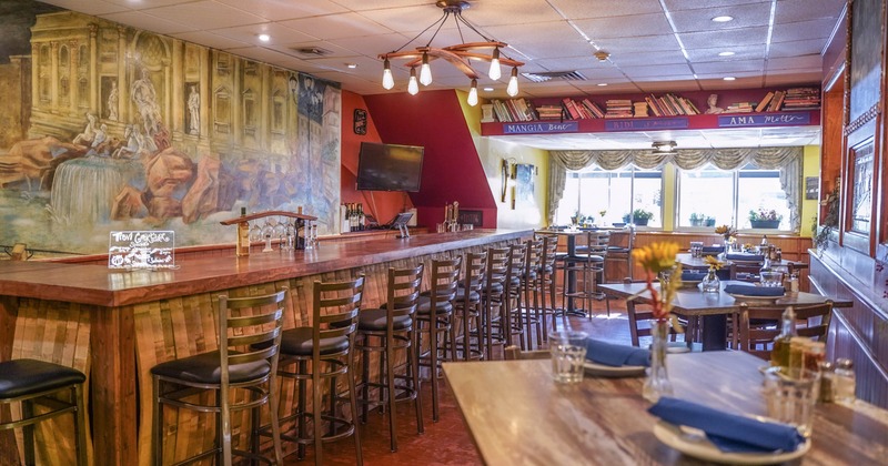 Interior, dining tables, bar area and bar stools