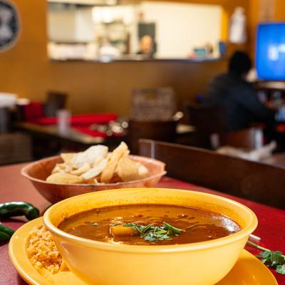 Mexican meatballs in tomato broth with vegetables, served with rice and tortilla chips.