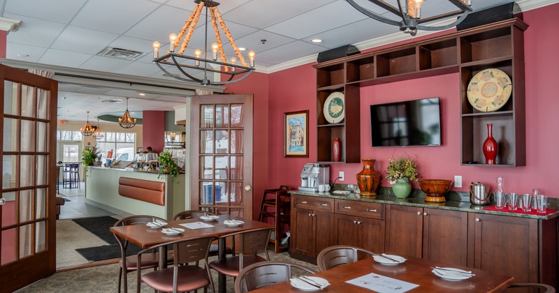 Interior, red walls, wooden tables and chairs
