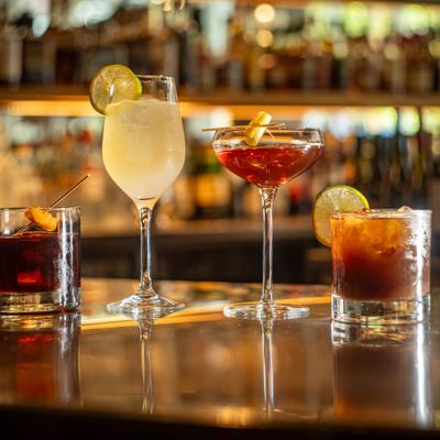 Lined-up cocktails, served, front view