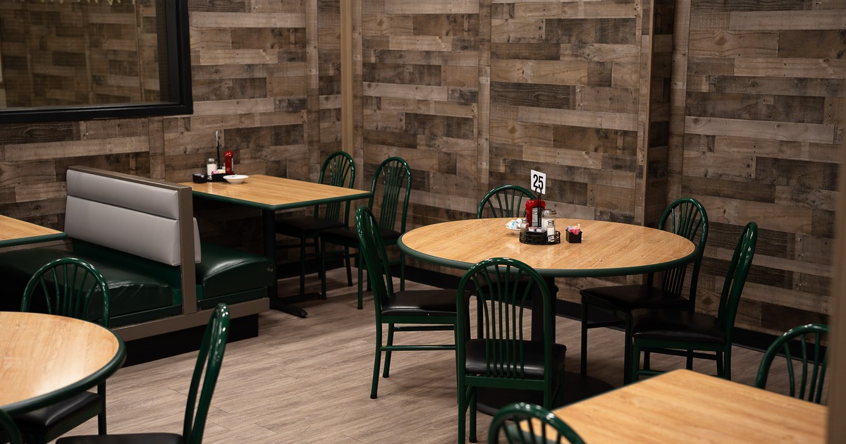 Cozy interior dining area with dining tables ready for guests