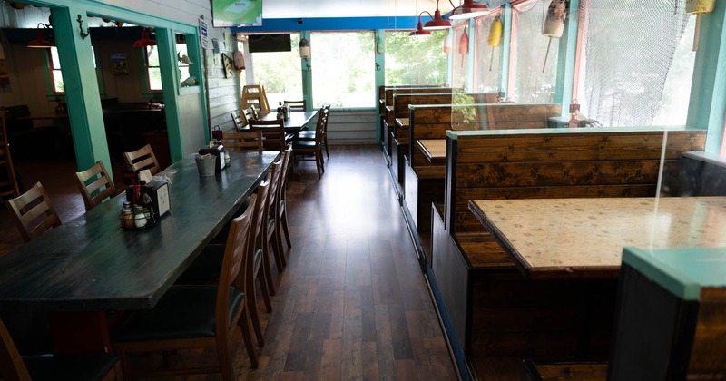 Interior, seating area with wooden booths and tables