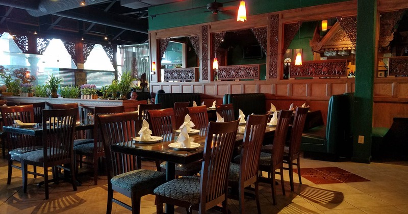 Interior, set tables in the dining area, Thai decor