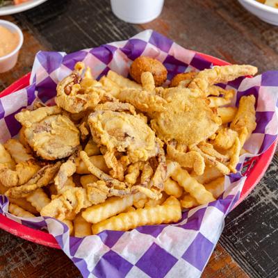 Portion of Fried Soft Shell Crab served with fries.