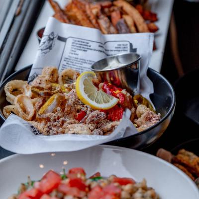 Fried calamari served with lemon and dipping sauce.