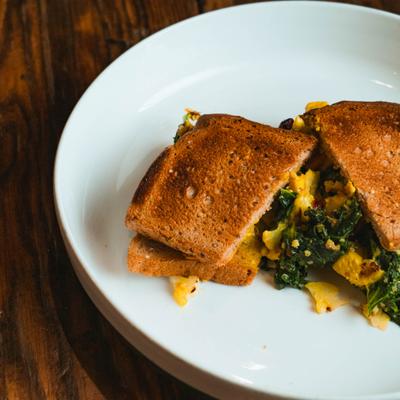 Egg Sandwich with spinach on a toasted bread.